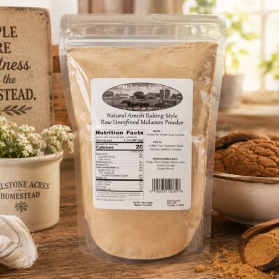 Molasses powder displayed in a bright rustic farmhouse kitchen with ginger snap cookies, wooden scoop, homestead decor, and warm natural baking-inspired styling.