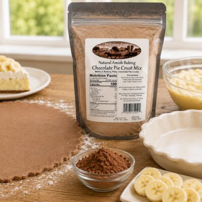 Millstone Acres Chocolate Pie Crust Mix with rolled chocolate pie crust dough, banana cream filling, sliced bananas, cocoa powder, and an empty pie pan ready for homemade dessert baking