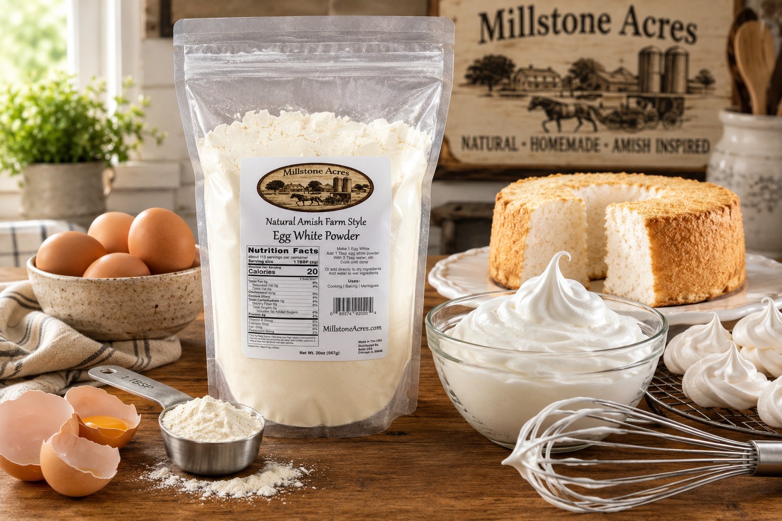 Millstone Acres Natural Egg White Powder displayed with whipped egg whites, meringues, angel food cake, a whisk, and brown eggs in a bright farmhouse kitchen.