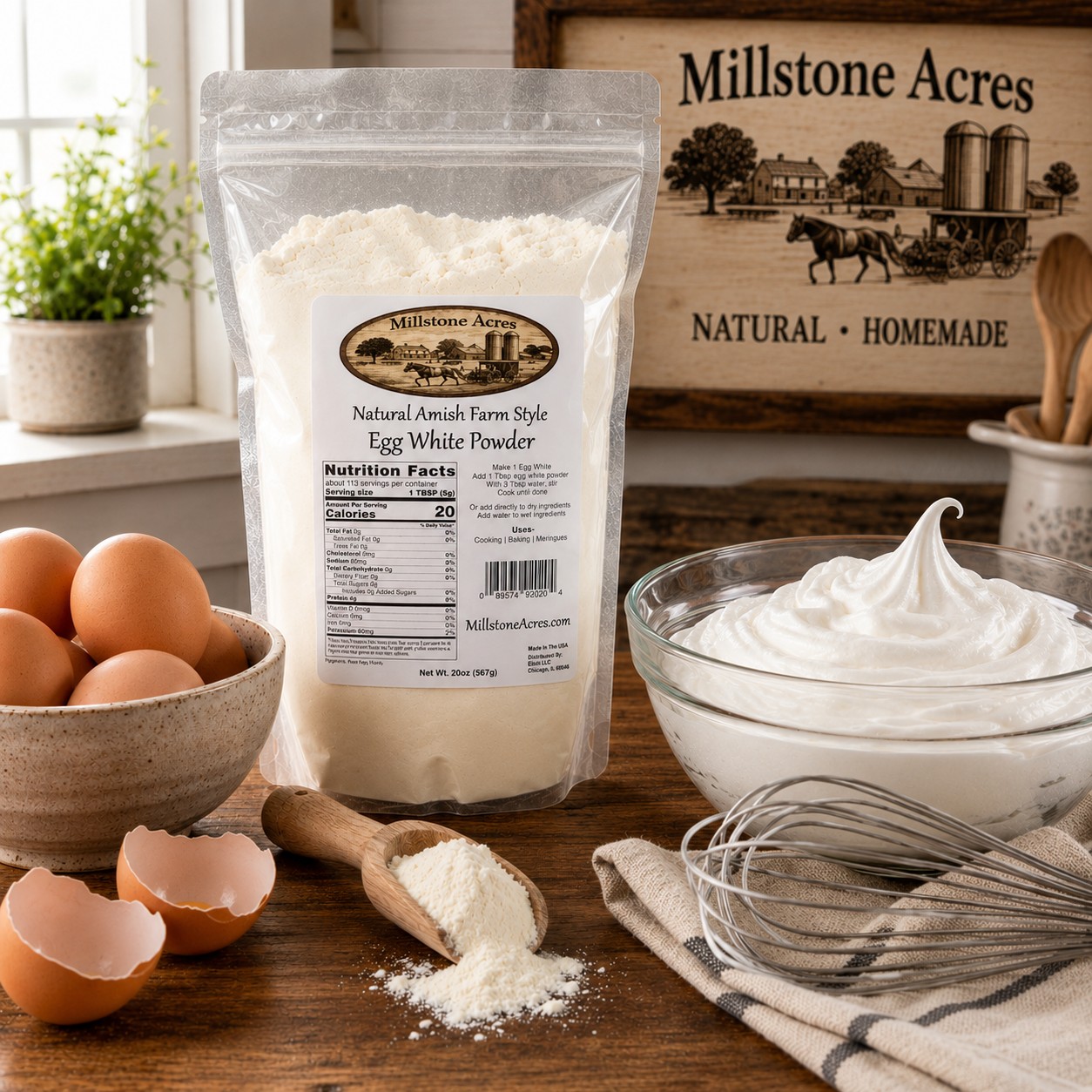 Millstone Acres Natural Egg White Powder displayed with fresh eggs, whipped egg whites, and a whisk on a farmhouse kitchen countertop.